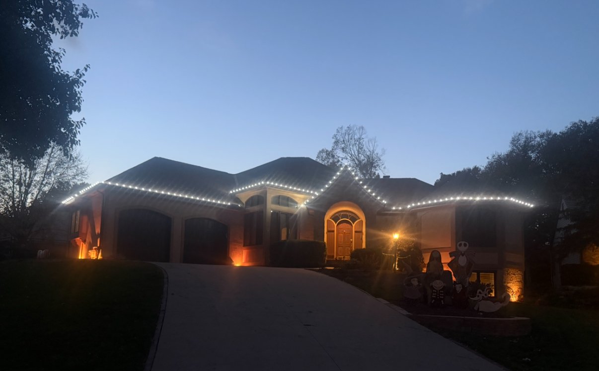 Christmas light installation on a large brick home in Lawrence, Kansas by First Response Exterior Lights
