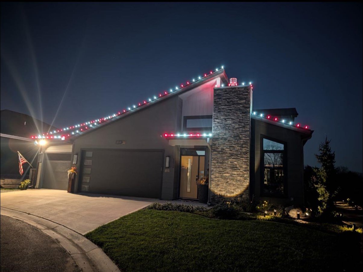 Christmas light installation on a modern home in Lawrence, Kansas by First Response Exterior Lights